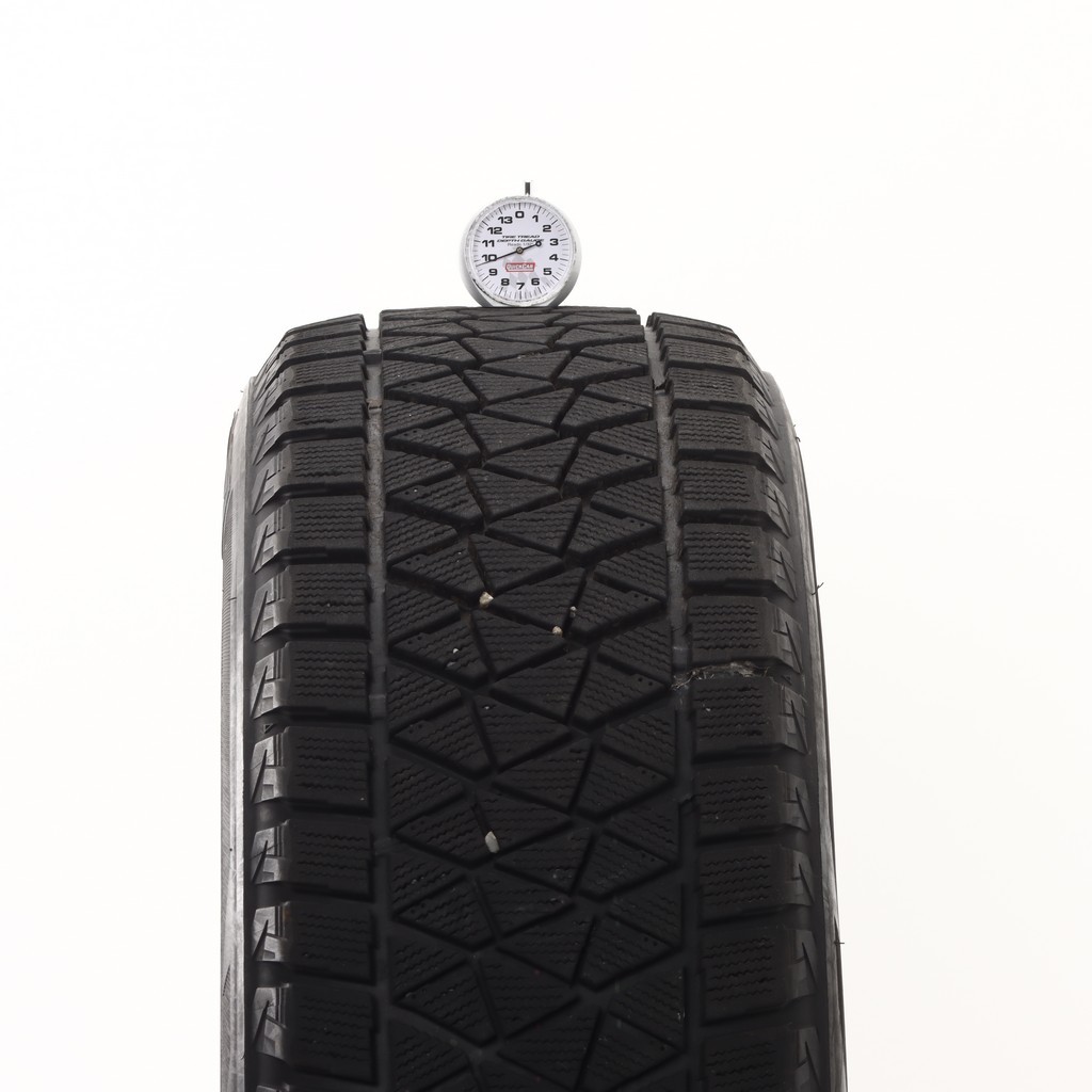 Set of (4) Used 235/60R18 Bridgestone Blizzak DM-V2 107S – 9.5-11/32 (XAVB)