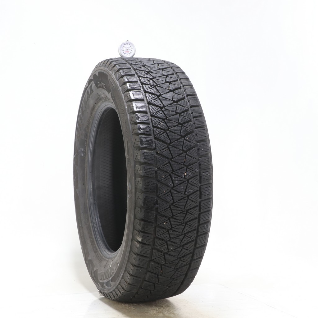 Set of (4) Used 235/65R17 Bridgestone Blizzak DM-V2 108S – 9.5-11/32