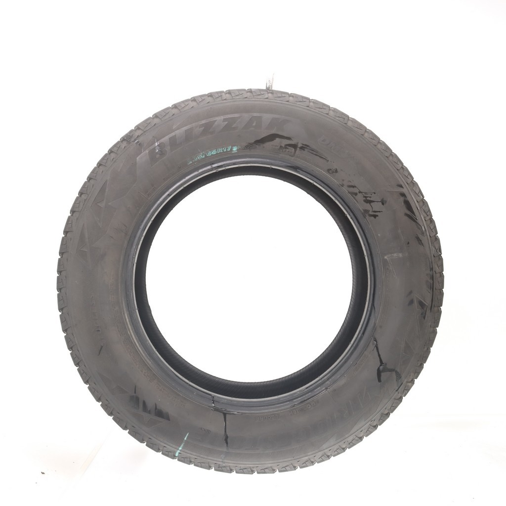 Set of (4) Used 235/65R17 Bridgestone Blizzak DM-V2 108S – 9.5-11/32