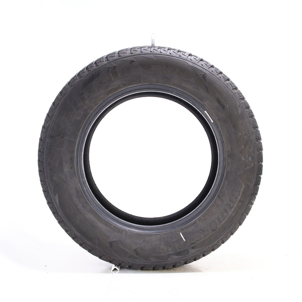 Set of (4) Used 235/65R17 Bridgestone Blizzak DM-V2 108S – 9.5-11/32