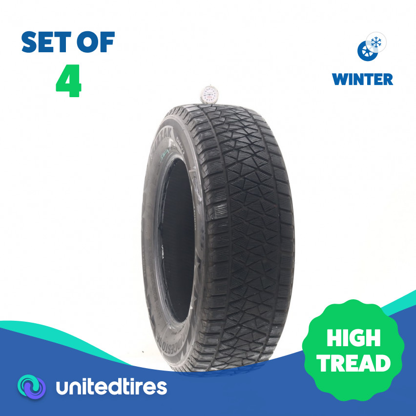Set of (4) Used 235/65R17 Bridgestone Blizzak DM-V2 108S – 10-12/32