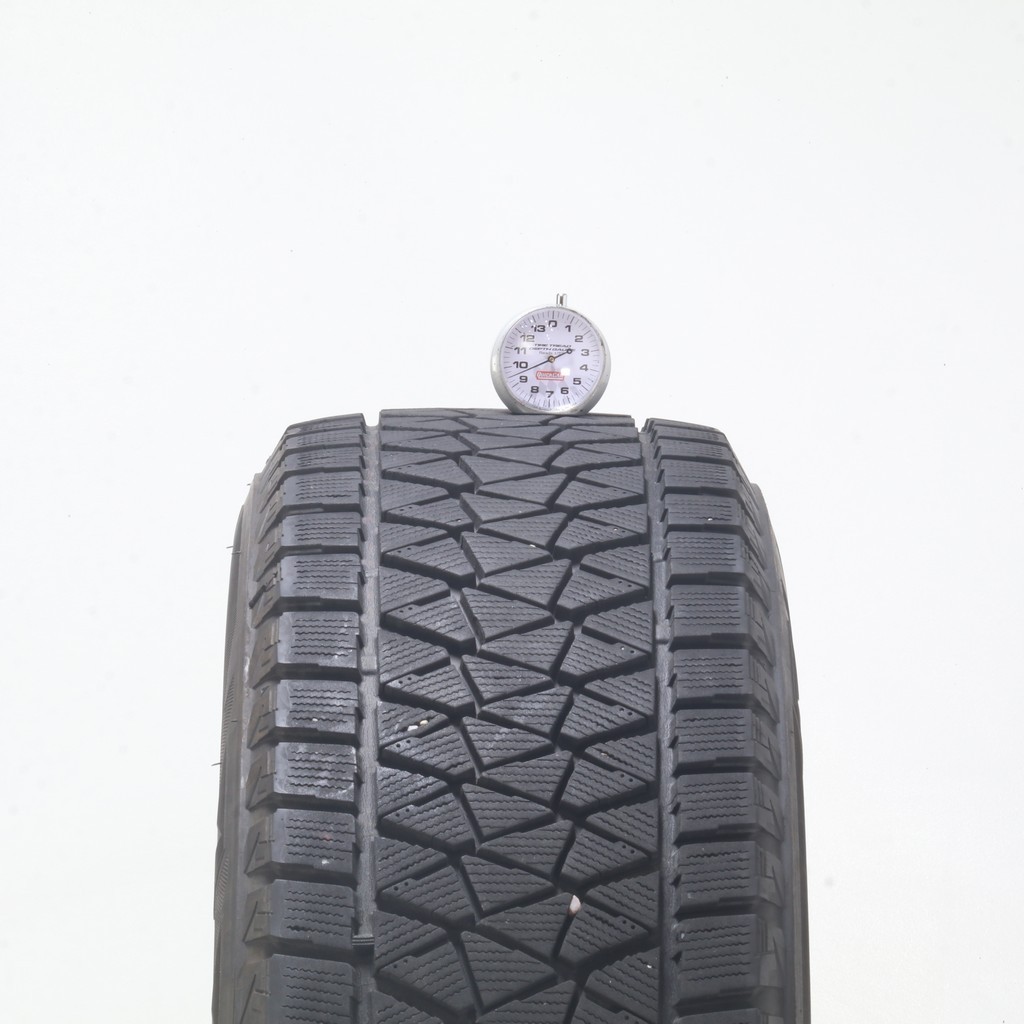Set of (4) Used 235/65R17 Bridgestone Blizzak DM-V2 108S – 9.5-11/32