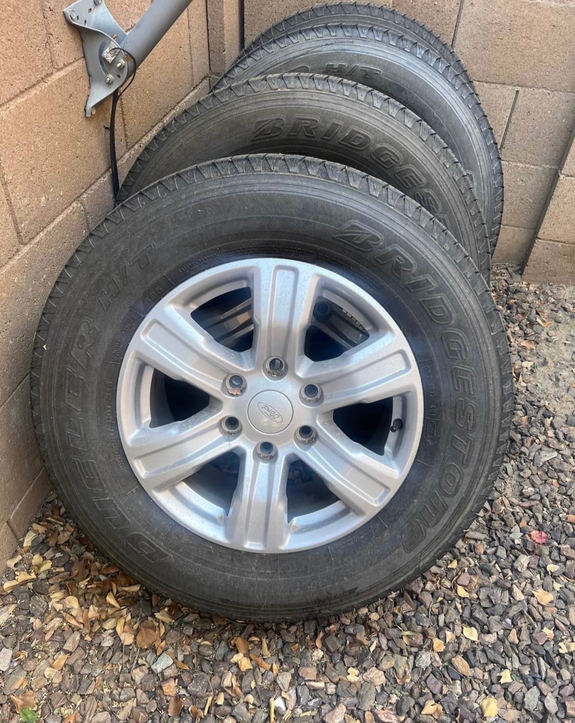 Four (4) Bridgestone Dueler 255/65r17 110T Tires AND Ford OEM 17-inch Alloy
