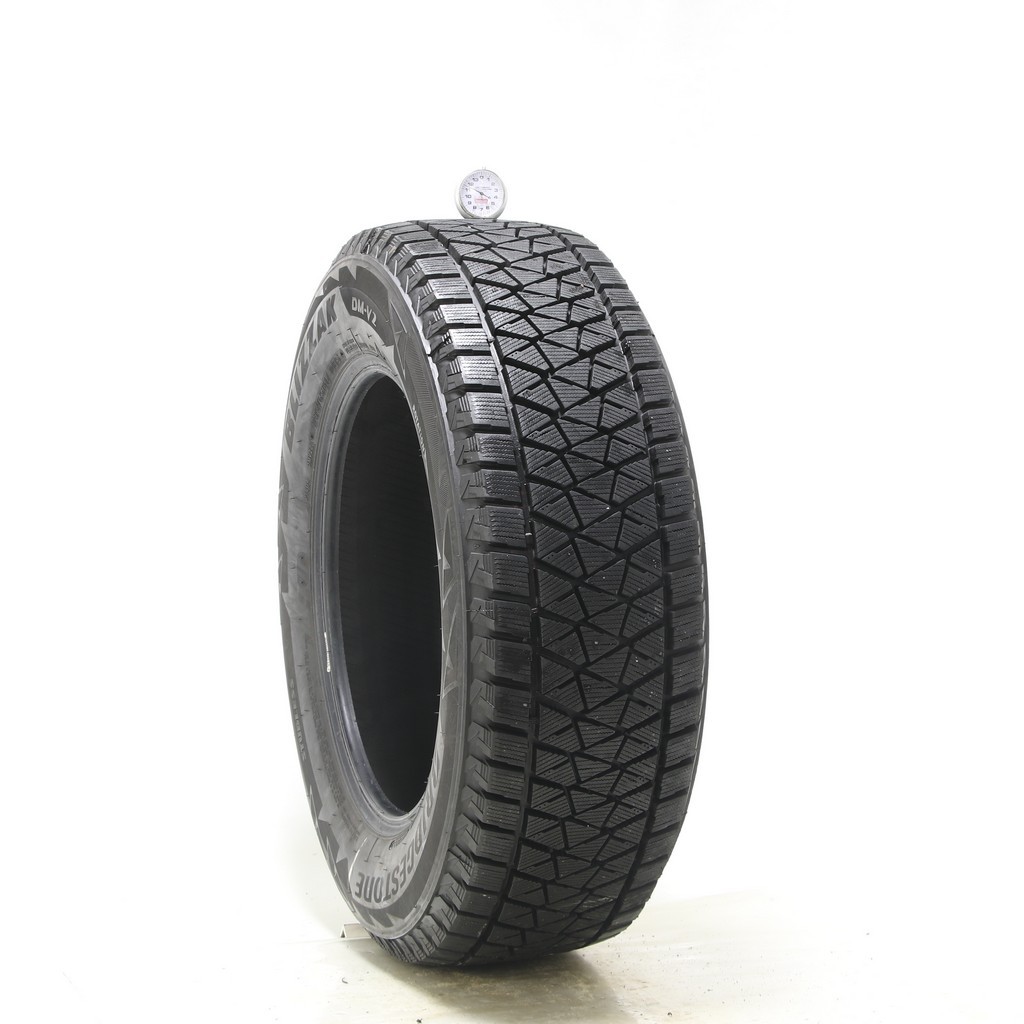 Set of (4) Used 235/65R17 Bridgestone Blizzak DM-V2 108S – 9.5-11/32