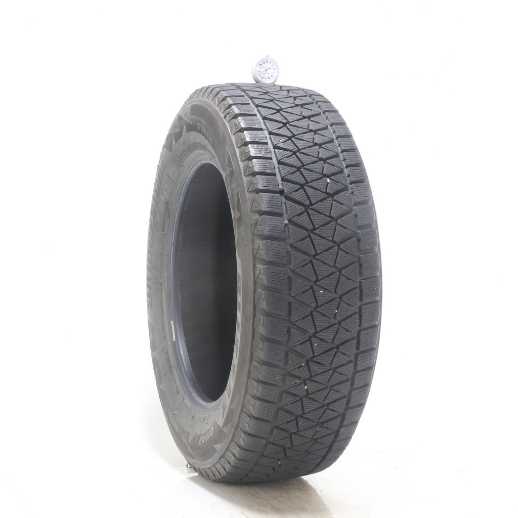 Set of (4) Used 235/65R17 Bridgestone Blizzak DM-V2 108S – 9.5-11/32