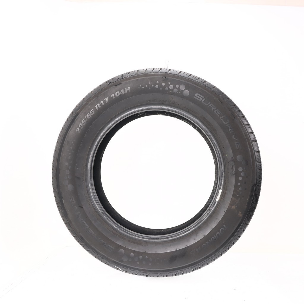 Set of (4) Used 235/65R17 SureDrive Touring A/S TA71 104H – 9-10/32