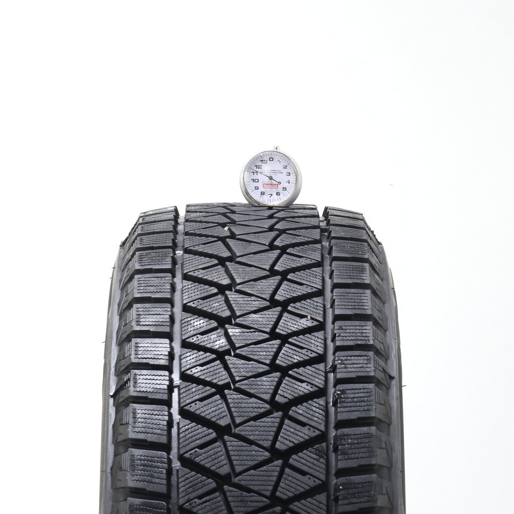 Set of (4) Used 235/65R17 Bridgestone Blizzak DM-V2 108S – 9.5-11/32