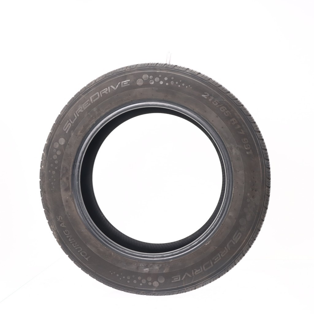 Set of (4) Used 215/65R17 SureDrive Touring A/S TA71 99T – 7-8/32