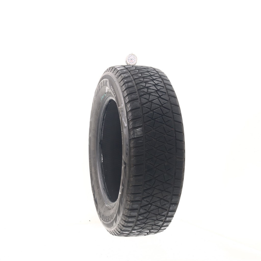 Set of (4) Used 235/65R17 Bridgestone Blizzak DM-V2 108S – 9.5-11/32