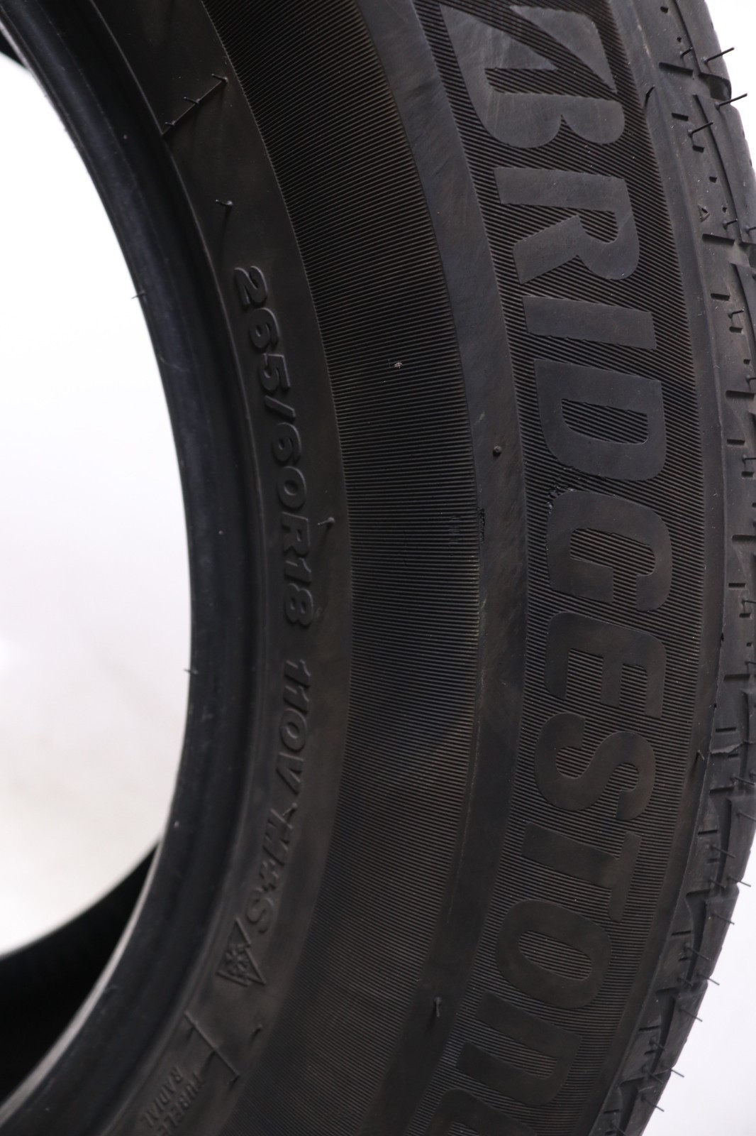 Set of 2 Used 265/60R18 Bridgestone WeatherPeak – 110V – 8-9/32