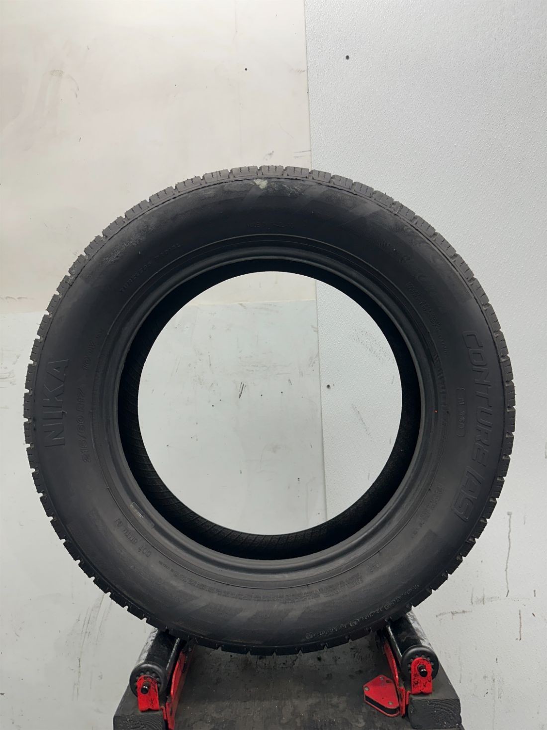 1 Used P215/60R17 Nika Conture AS 100 V – 9/32