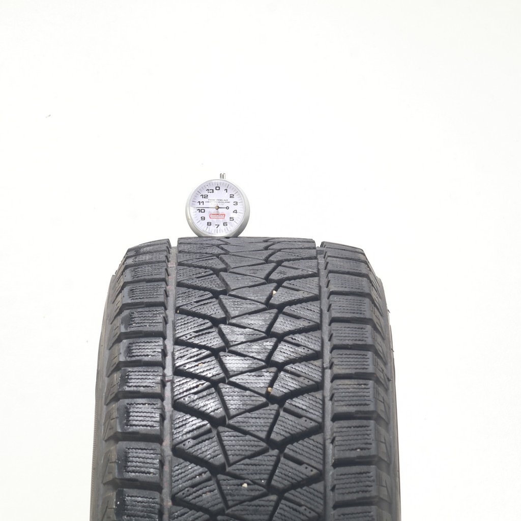 Set of (4) Used 235/65R17 Bridgestone Blizzak DM-V2 108S – 9.5-11/32